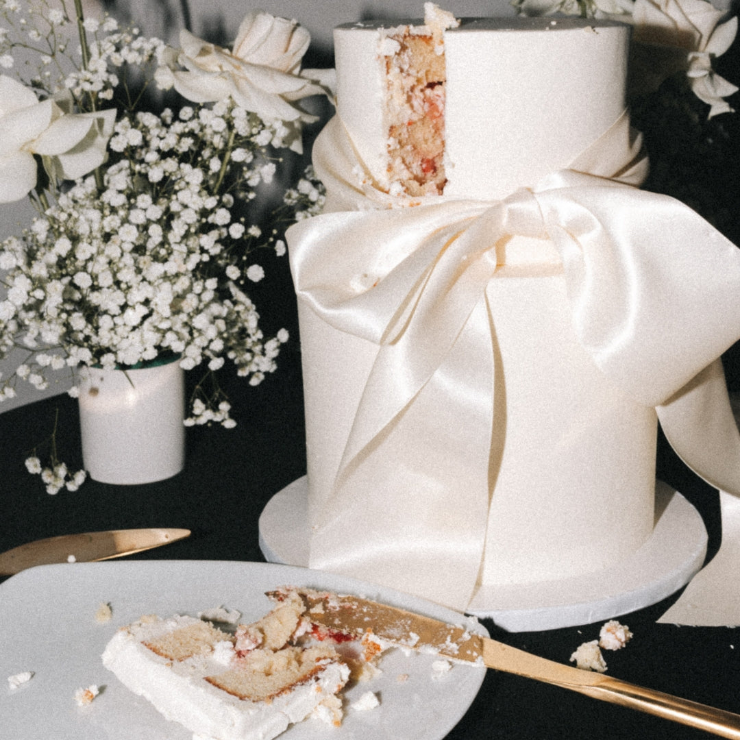 2 tier wedding cake with thick satin bow and minimal design for a wedding in Montreal