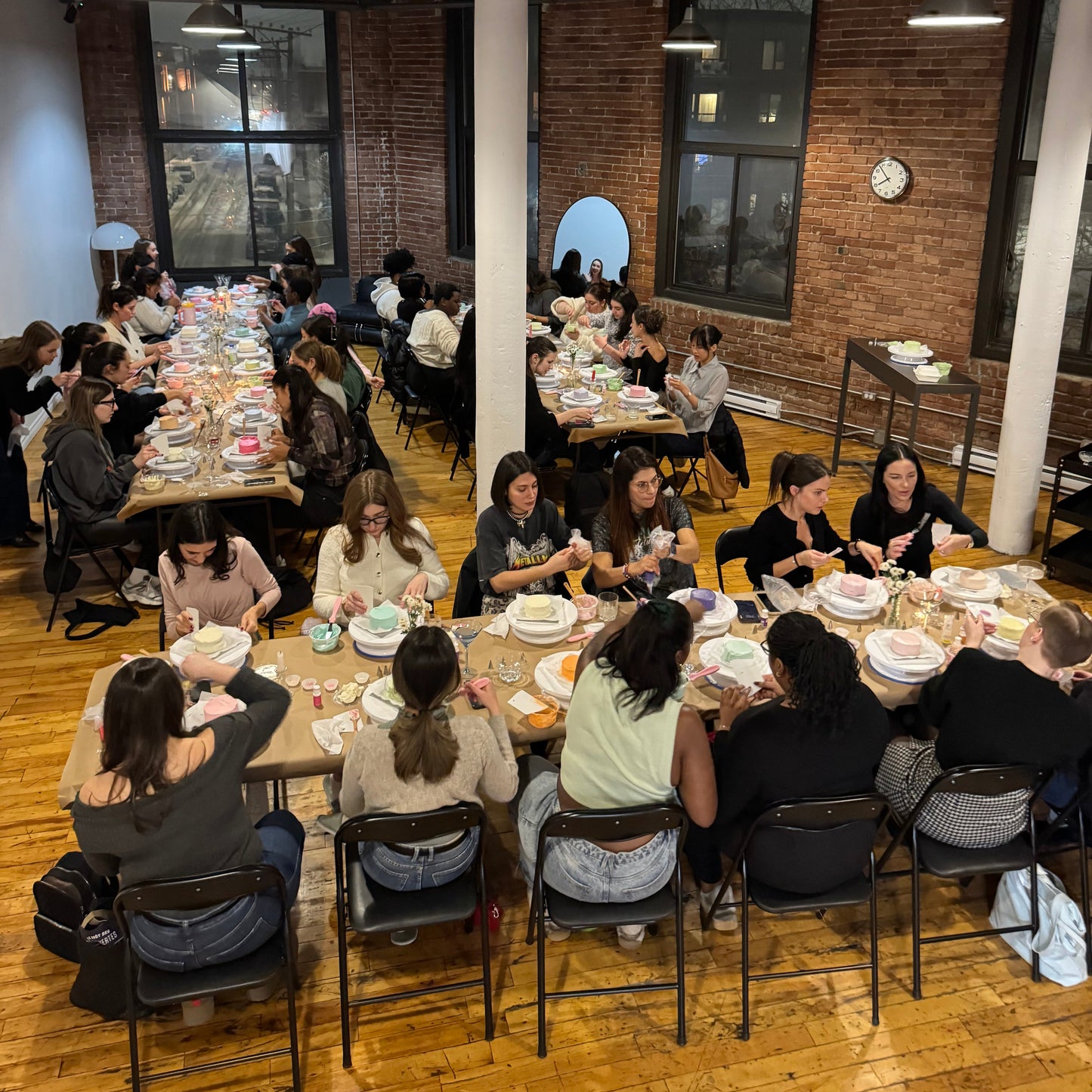 Guests decorating their own bento cake during a cake & sip event in Montreal