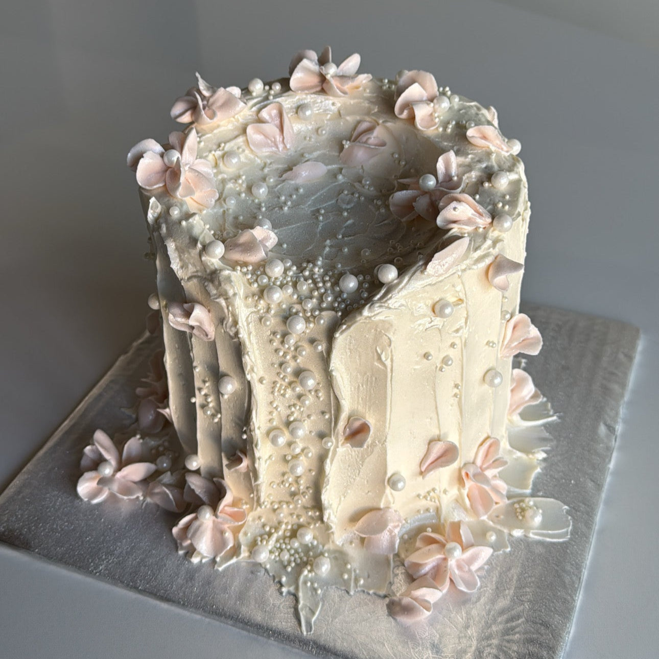 Cake in the shape of a candle with flowers