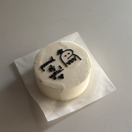 bento cake with stick figure drawings