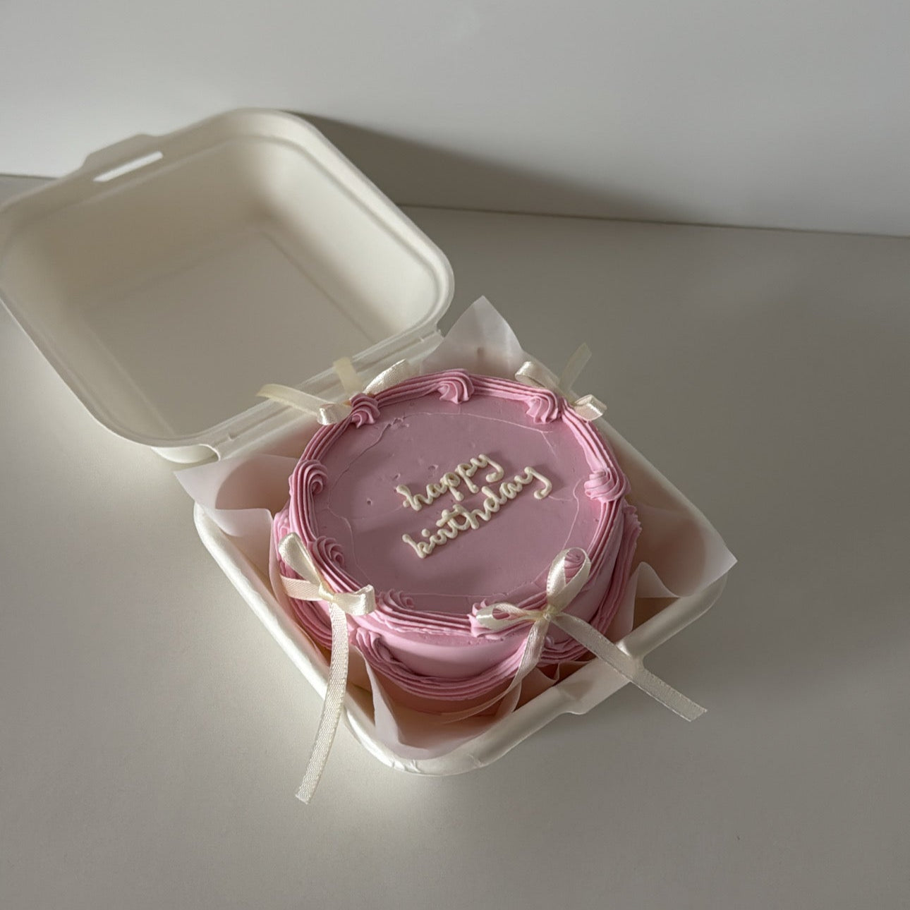 heart shaped bento cake with bows in Montreal