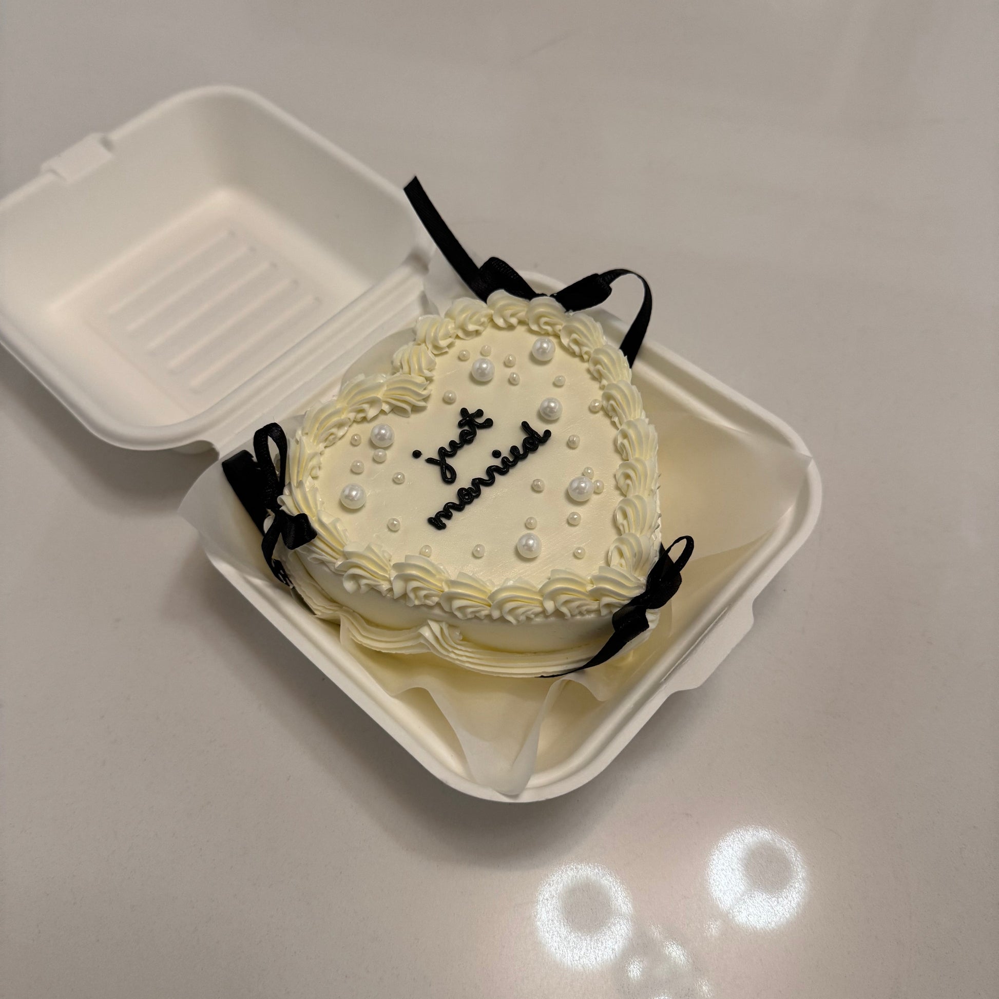 heart shaped bento cake with bows in Montreal