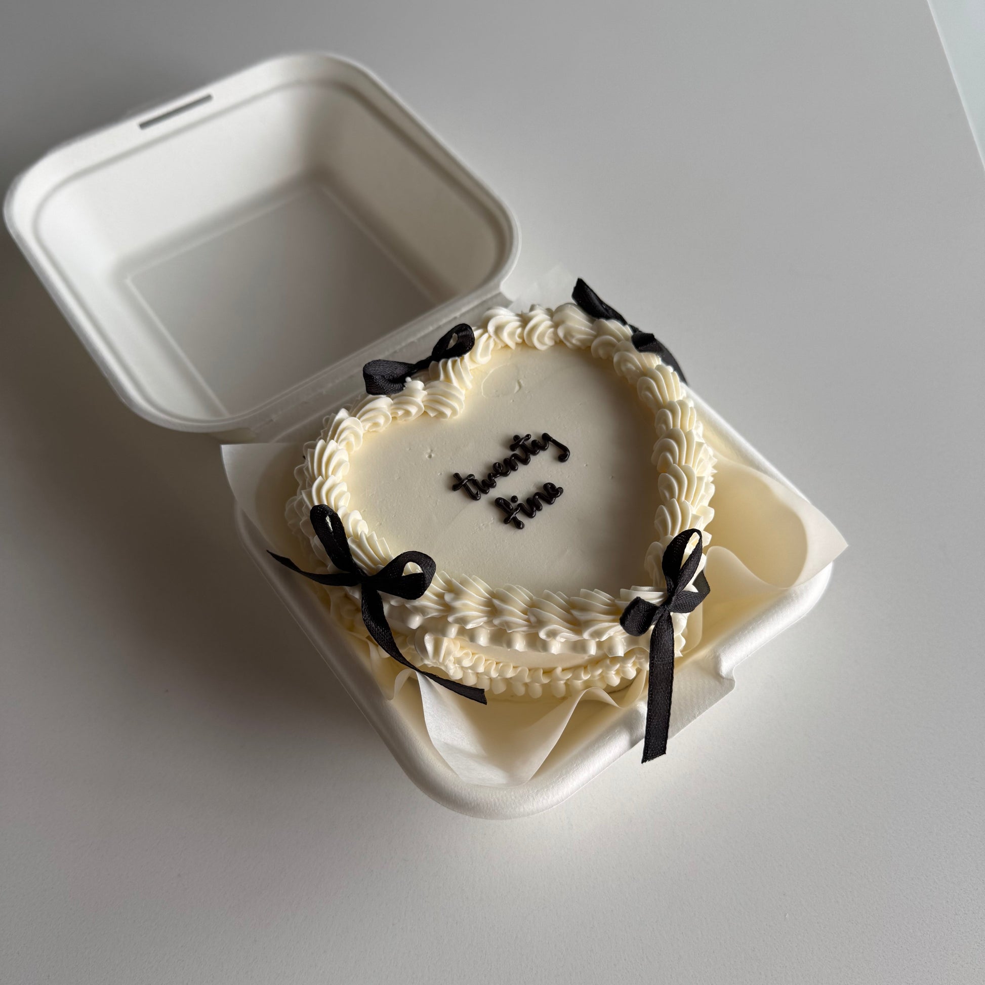 heart shaped bento cake with bows in Montreal