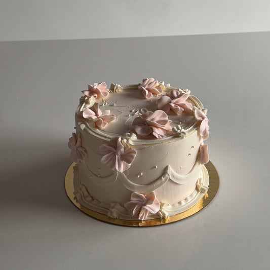 vintage cake with piped flowers and pearls