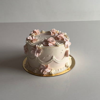 vintage cake with piped flowers and pearls