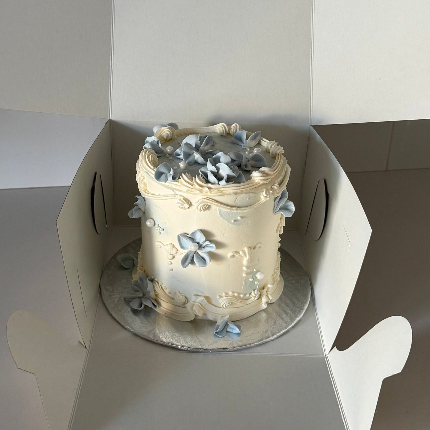 vintage cake with piped flowers and pearls