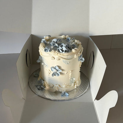 vintage cake with piped flowers and pearls